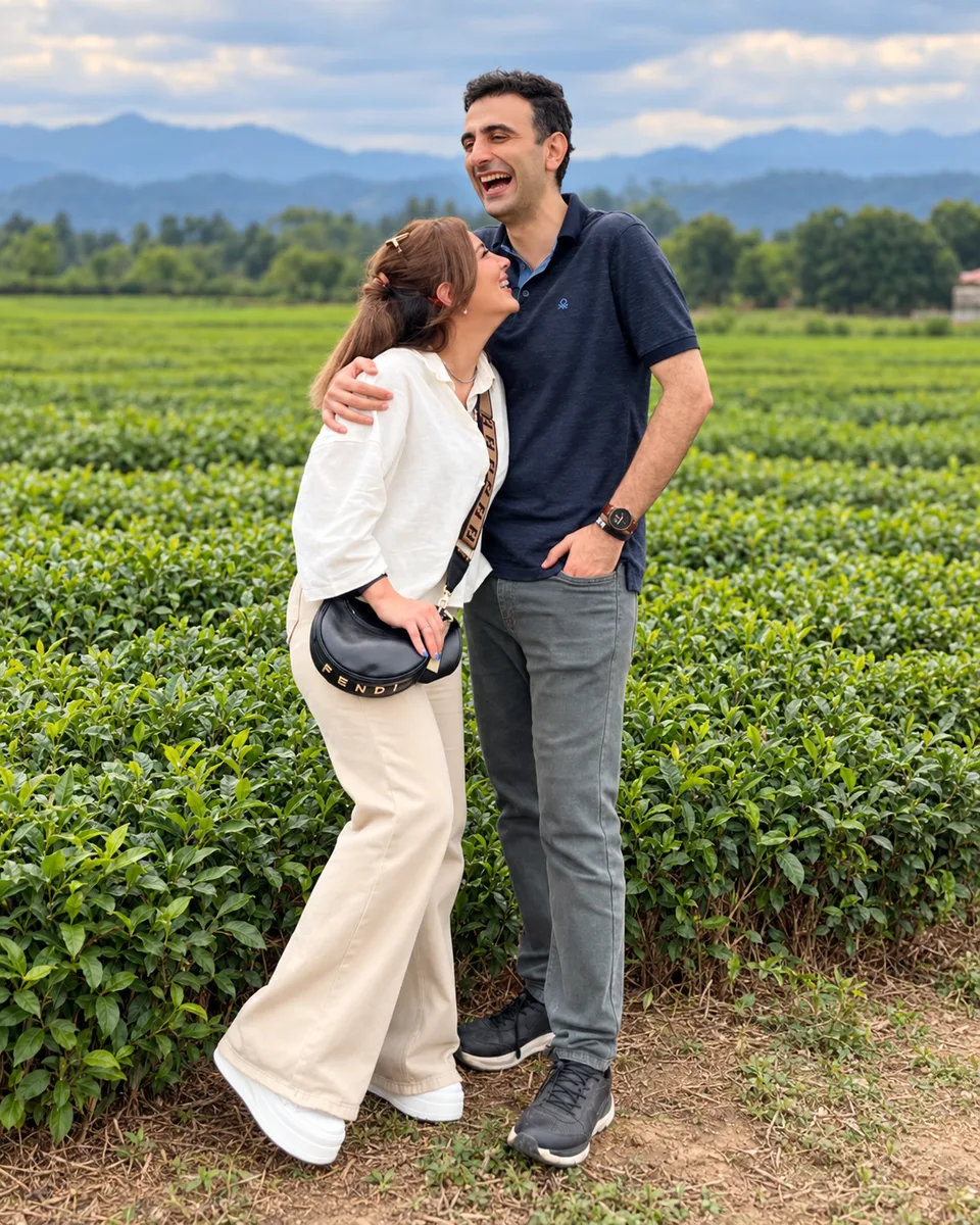 Kimia and Arash laughing together in a green field